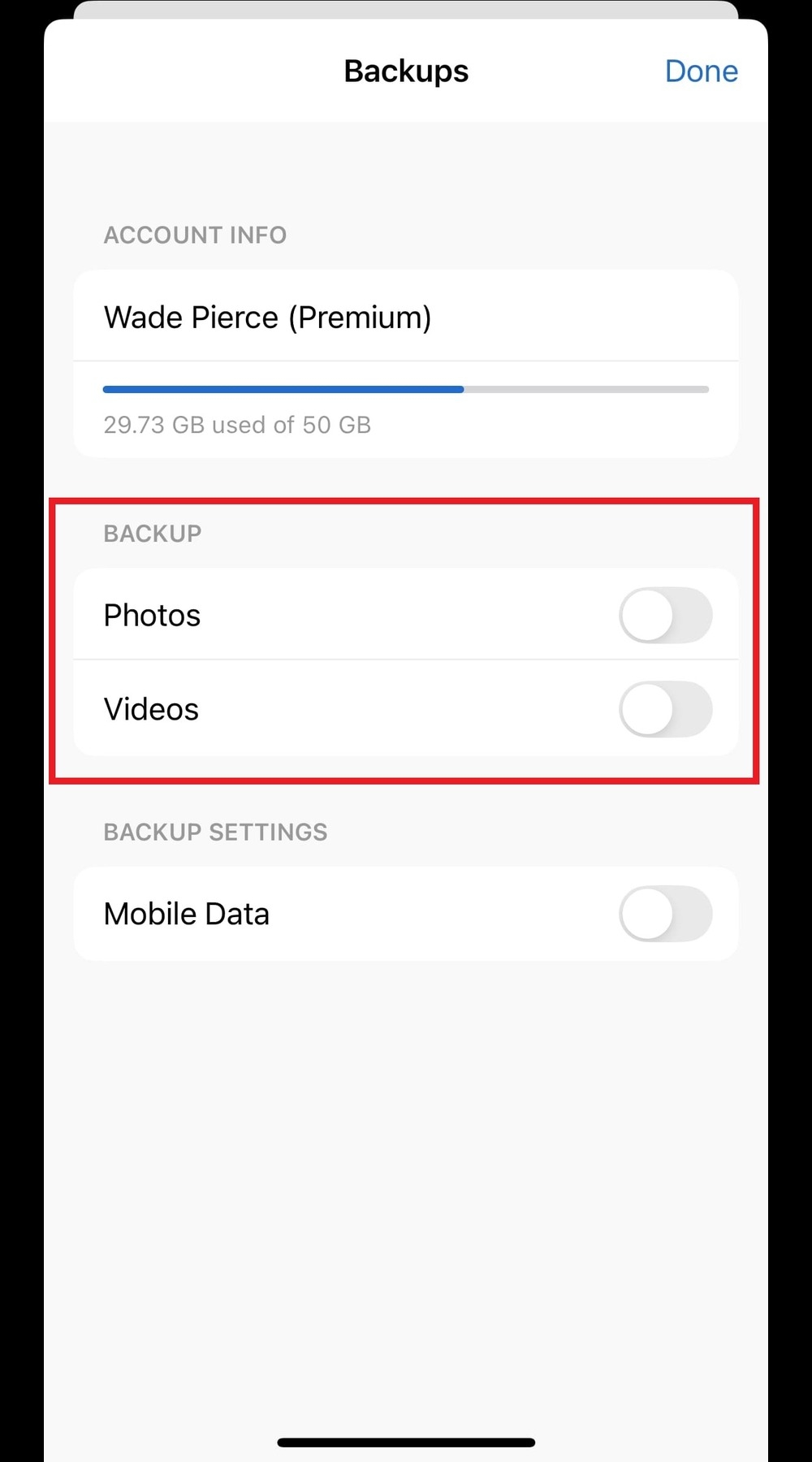MobiDrive for iOS "Backups" settings screen showcasing account info for Wade Pierce, with toggles to back up "Photos" and "Videos," and an option to use "Mobile Data" for backups.